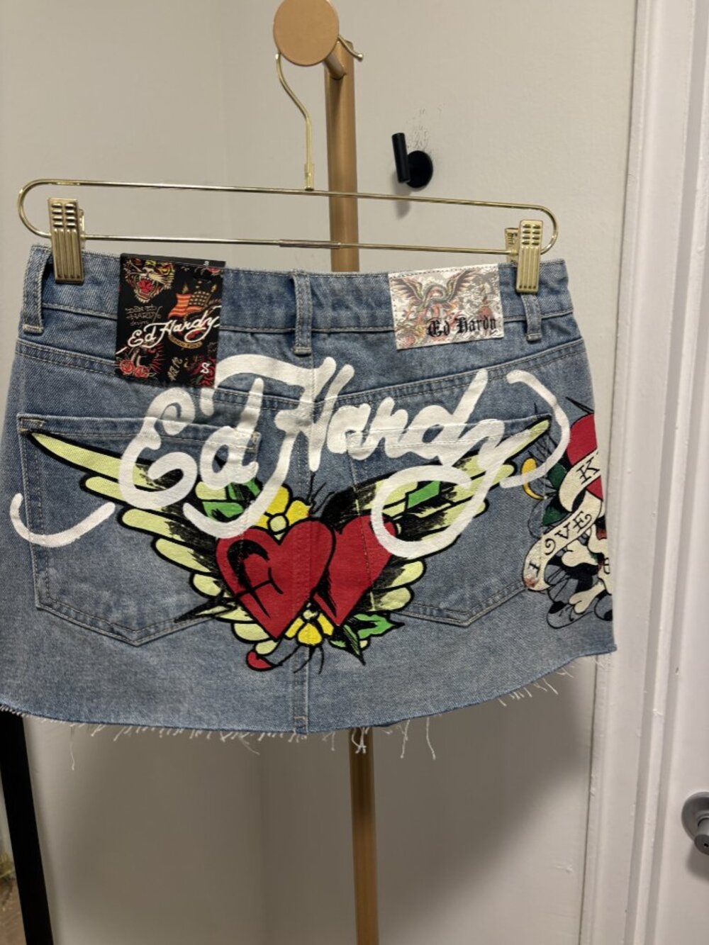 Ed Hardy mini jean skirt with printed logo size small.